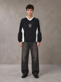 Model wearing the SM Royal Emblem Sport Sweatshirt in Midnight Black, front view.