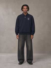 Model wearing the SM Royal Emblem Sweatshirt in Oxford Navy, front view.