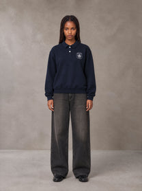 Model wearing the SM Royal Emblem Sweatshirt in Oxford Navy, front view.