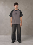 Model wearing the SM Royal Emblem T-shirt in Coffee Grey, front view.