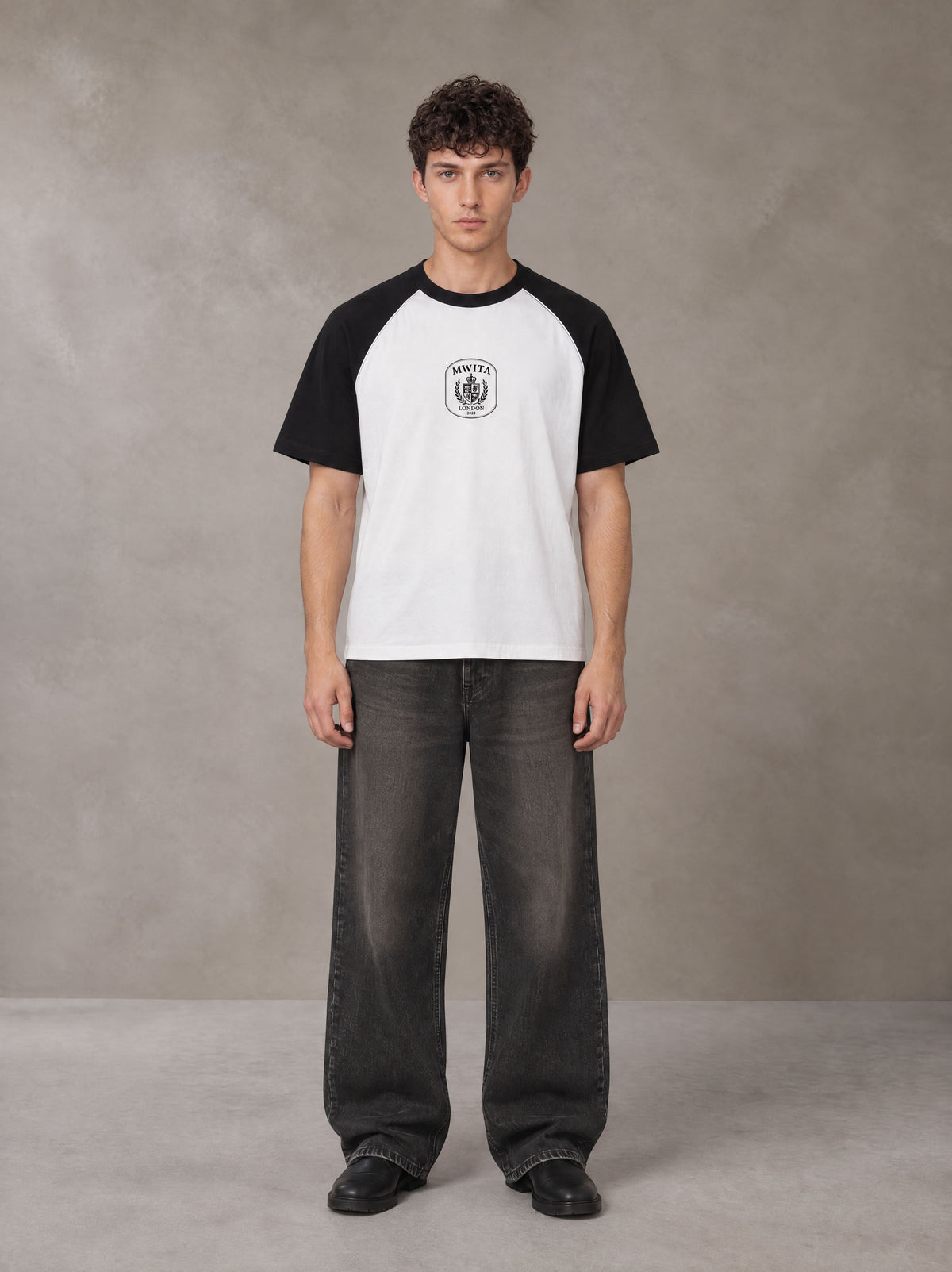 Model wearing the SM Royal Emblem T-shirt in Lucent White, front view.