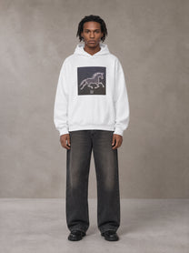 Model wearing the SM Celestial Charge Hoodie in Lucent White, front view.