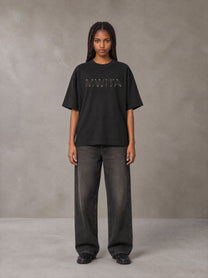 Model wearing the SM Clip T-shirt in Midnight Black, front view.