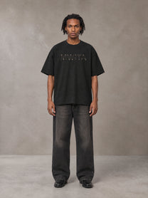Model wearing the SM Clip T-shirt in Midnight Black, front view.