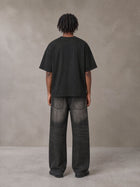 Model wearing the SM Clip T-shirt in Midnight Black, rear view.