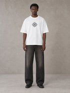 Model wearing the SM Fleur T-shirt in Lucent White, front view.