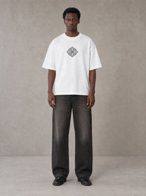 Model wearing the SM Fleur T-shirt in Lucent White, front view.