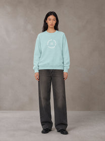 Model wearing the SM London Sweatshirt in Ice Blue, front view.