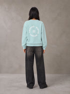 Model wearing the SM London Sweatshirt in Ice Blue, rear view.