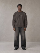 Model wearing the SM London Sweatshirt in Kabul Brown, front view.