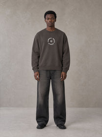 Model wearing the SM London Sweatshirt in Kabul Brown, front view.