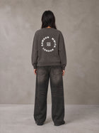 Model wearing the SM London Sweatshirt in Kabul Brown, rear view.