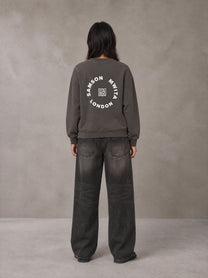 Model wearing the SM London Sweatshirt in Kabul Brown, rear view.