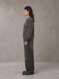 Model wearing the SM London Sweatshirt in Kabul Brown, side profile.