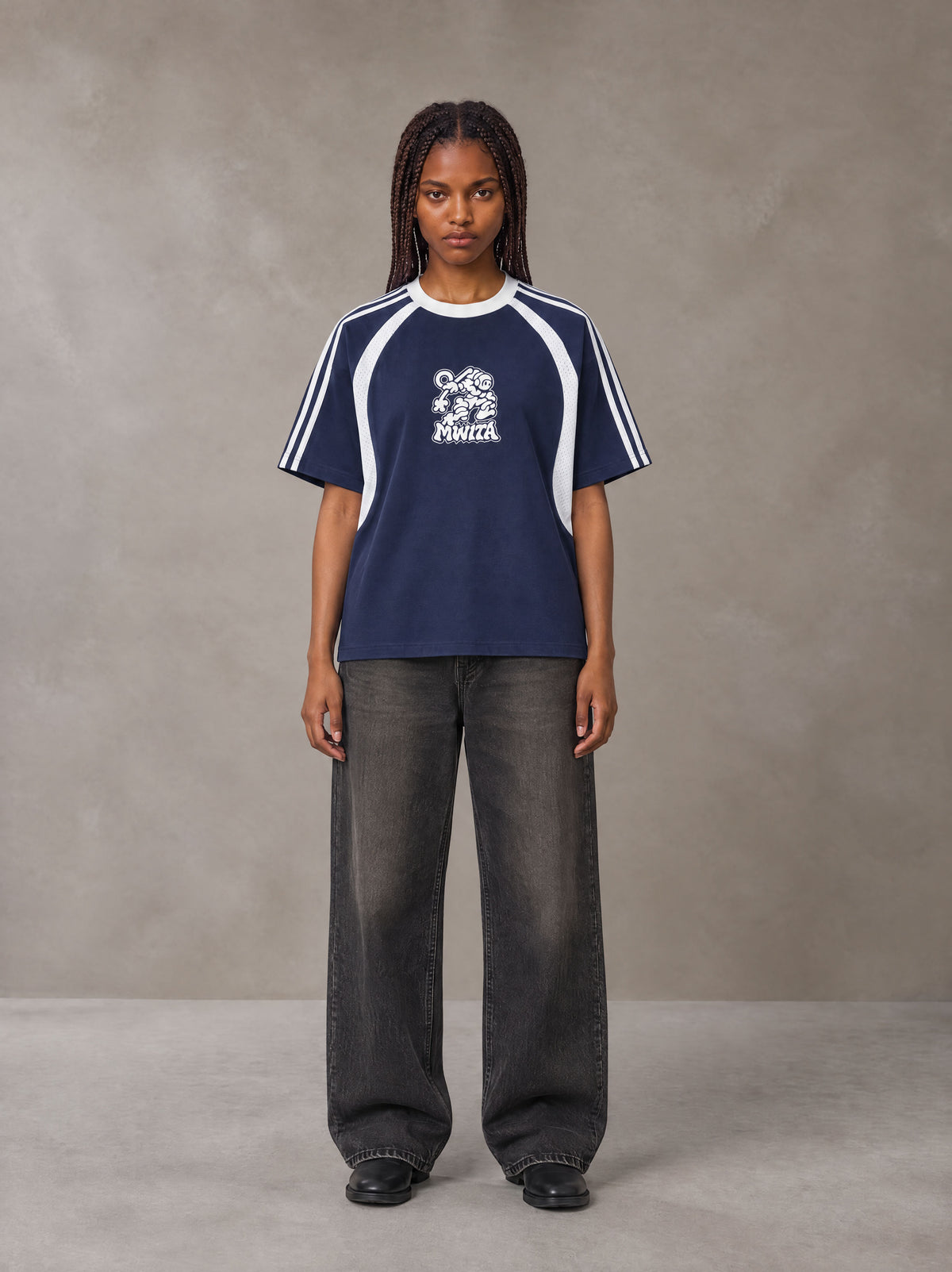 Model wearing the SM Cosmic Bloom T-shirt in Oxford Navy, front view.