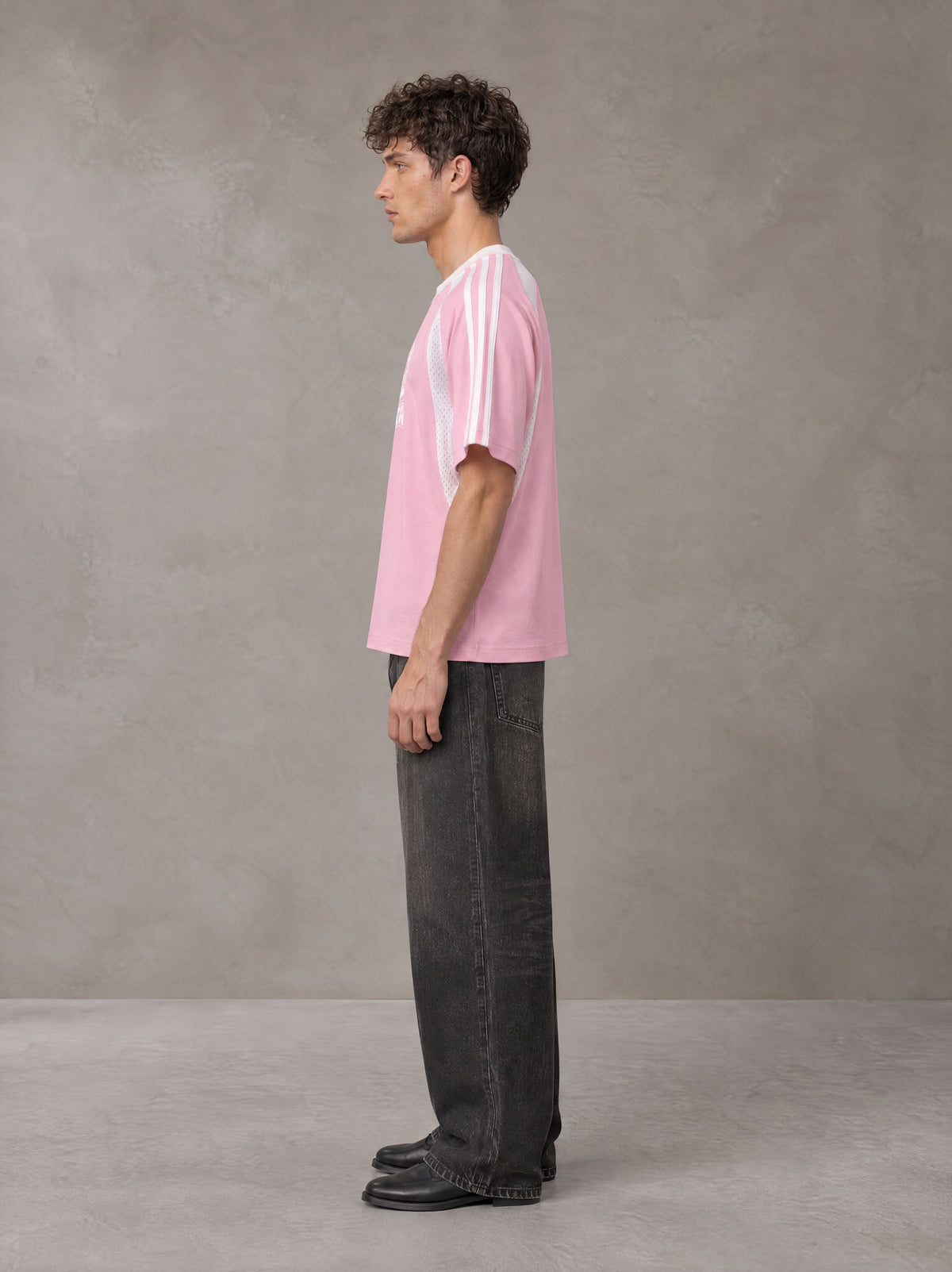 Model wearing the SM Cosmic Bloom T-shirt in Blossom, side profile.