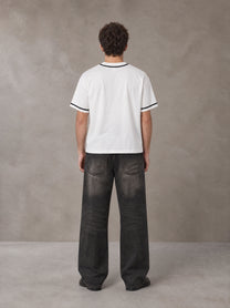 Model wearing the SM Dugout Atelier T-shirt in Lucent White, rear view.
