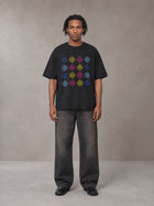 Model wearing the SM Fleur Matrix T-shirt in Midnight Black, front view.