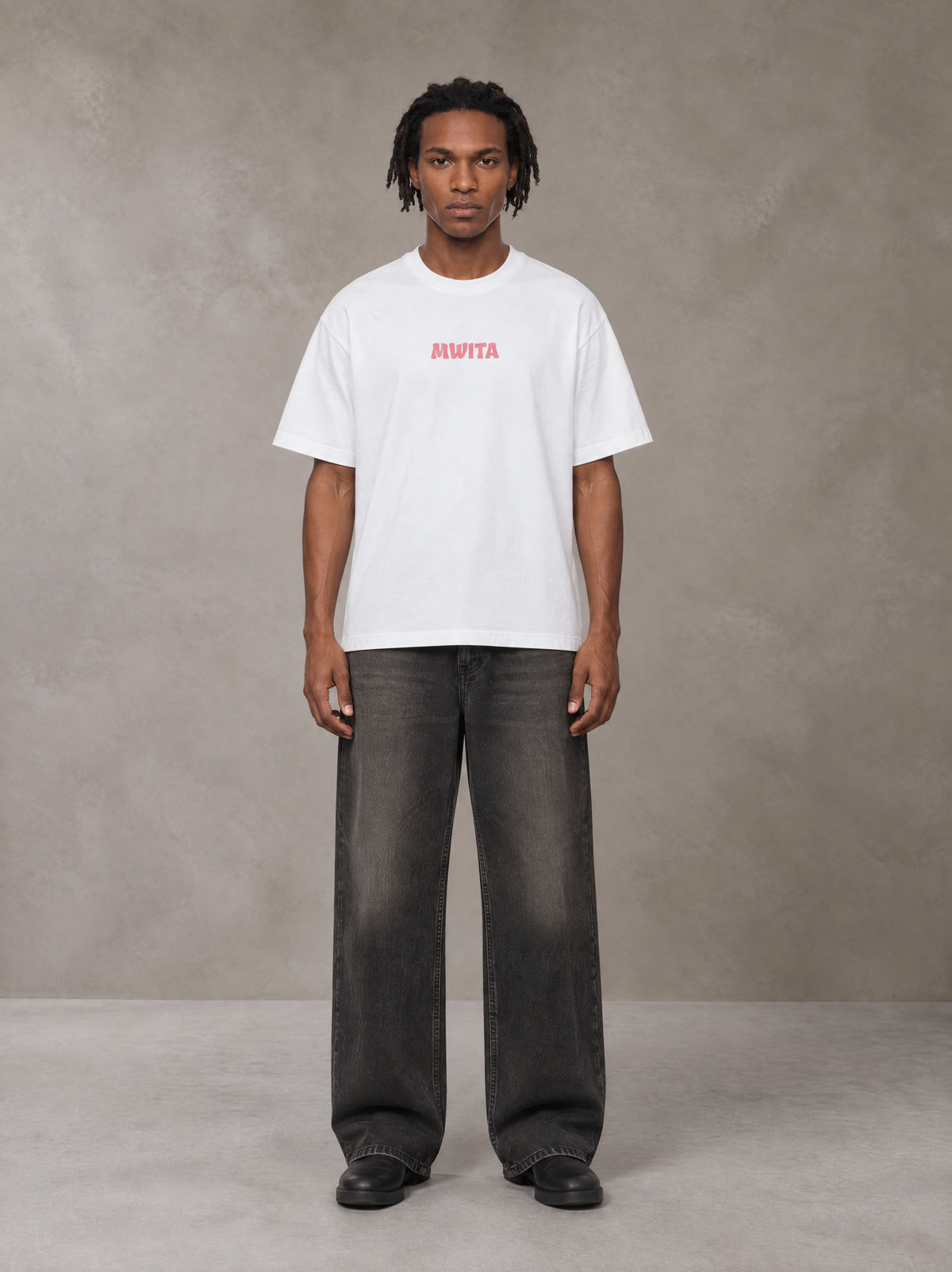 Model wearing the SM Floral Essence T-shirt in Lucent White, front view.