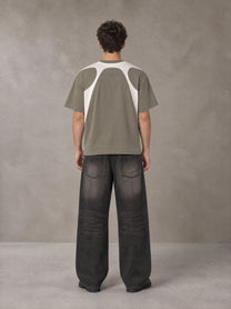 Model wearing the SM Graffiti Stack T-shirt in Coffee Grey, rear view.