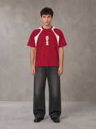 Model wearing the SM Graffiti Stack T-shirt in Crimson, front view.