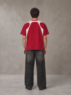 Model wearing the SM Graffiti Stack T-shirt in Crimson, rear view.