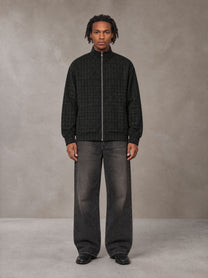 Model wearing the SM Jacquard Track Jacket in Midnight Black, front view.