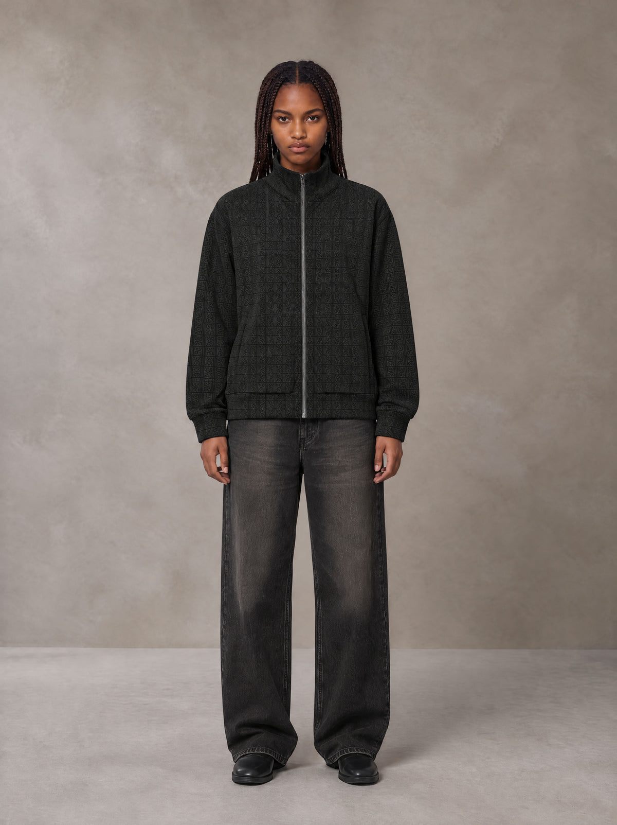Model wearing the SM Jacquard Track Jacket in Midnight Black, front view.
