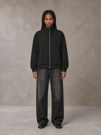 Model wearing the SM Jacquard Track Jacket in Midnight Black, front view.