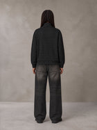 Model wearing the SM Jacquard Track Jacket in Midnight Black, rear view.
