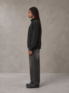 Model wearing the SM Jacquard Track Jacket in Midnight Black, side profile.