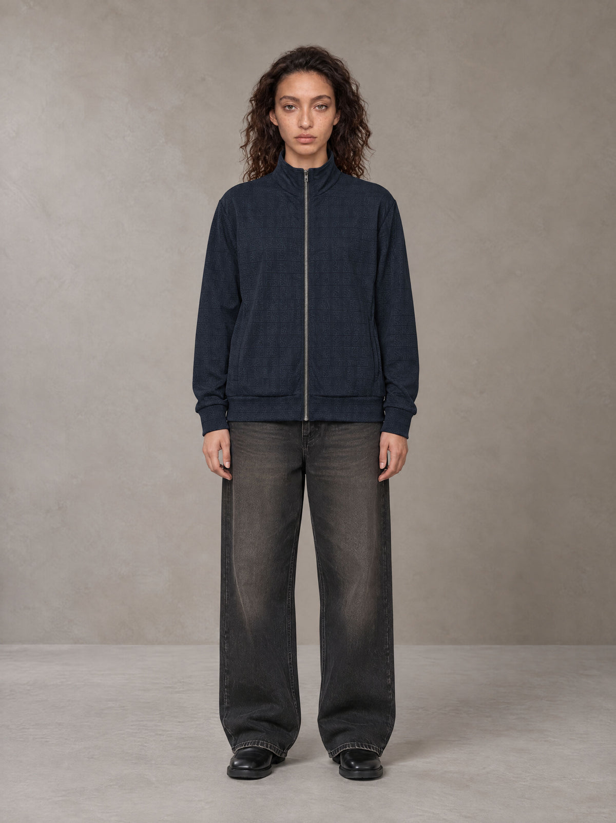 Model wearing the SM Jacquard Track Jacket in Oxford Navy, front view.