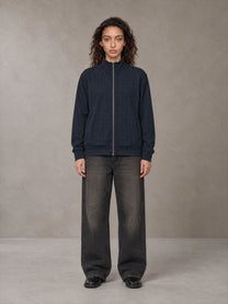 Model wearing the SM Jacquard Track Jacket in Oxford Navy, front view.