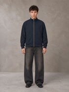 Model wearing the SM Jacquard Track Jacket in Oxford Navy, front view.