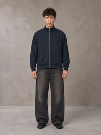 Model wearing the SM Jacquard Track Jacket in Oxford Navy, front view.