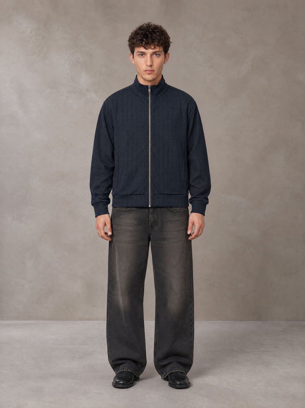 Model wearing the SM Jacquard Track Jacket in Oxford Navy, front view.