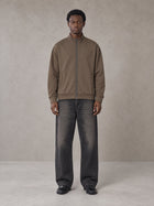 Model wearing the SM Jacquard Track Jacket in Kabul Brown, front view.