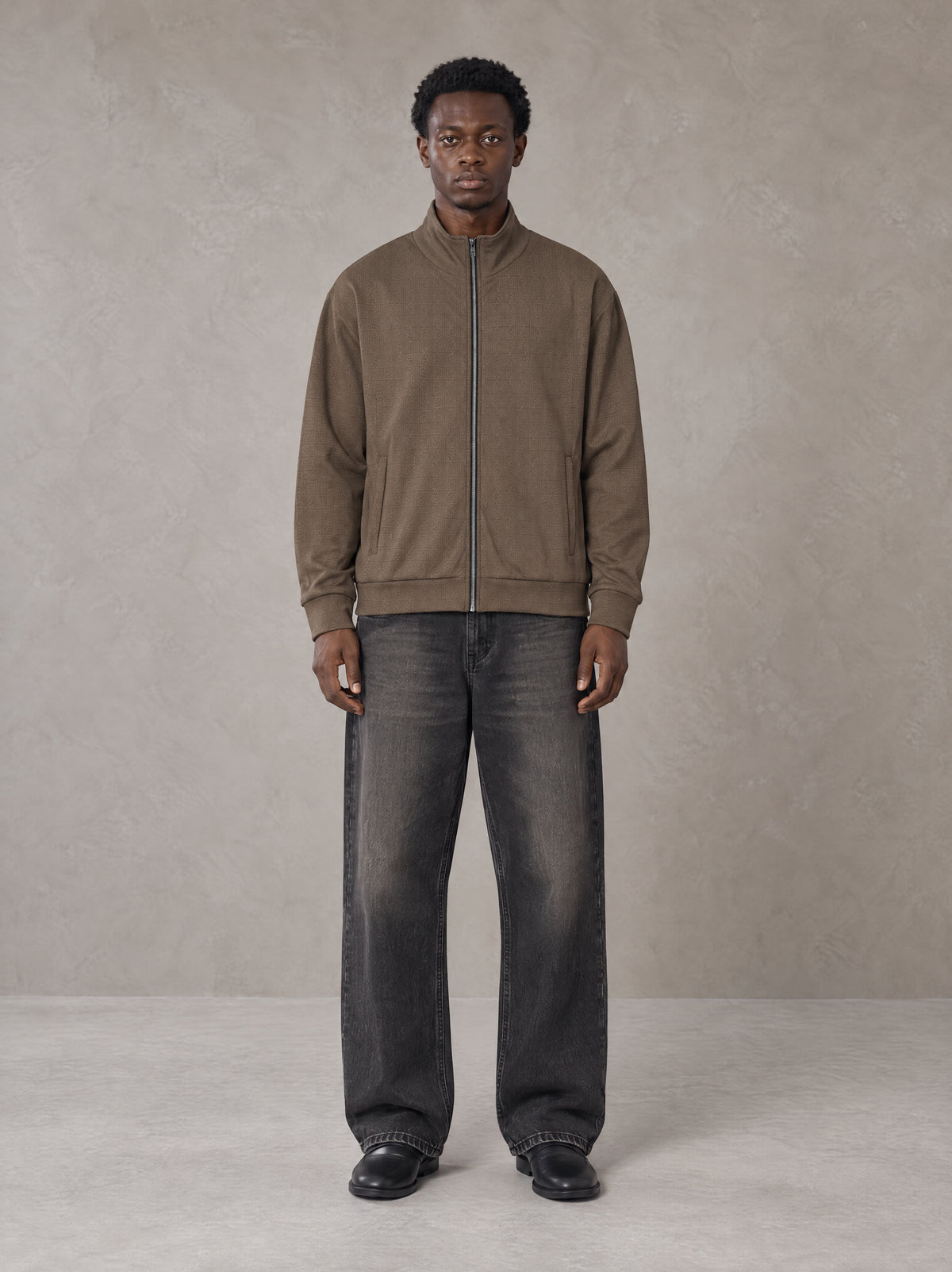 Model wearing the SM Jacquard Track Jacket in Kabul Brown, front view.