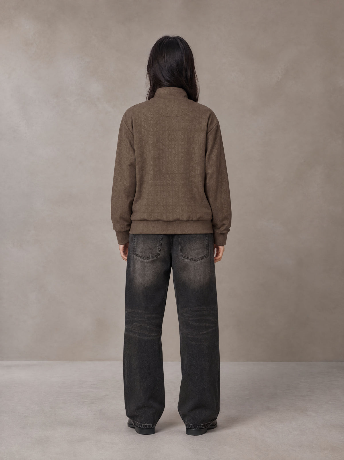 Model wearing the SM Jacquard Track Jacket in Kabul Brown, rear view.