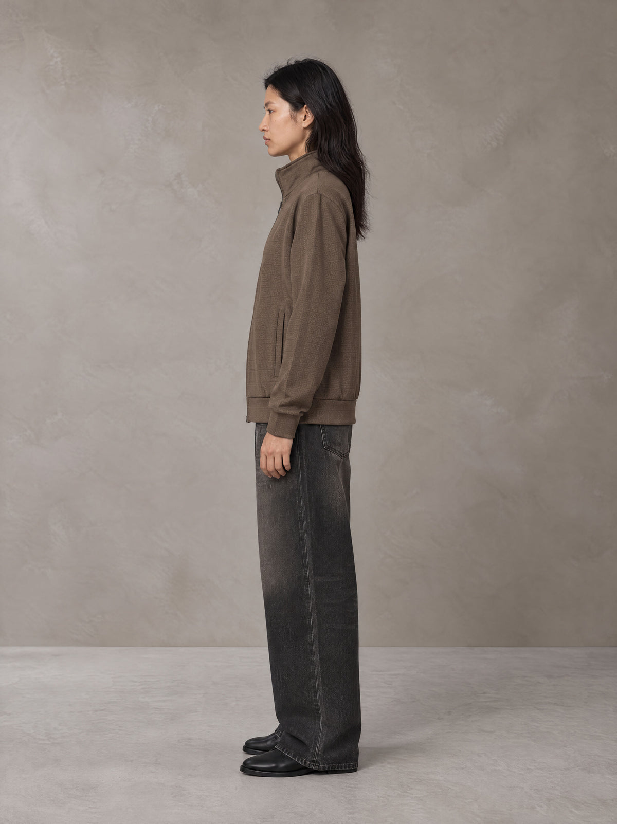 Model wearing the SM Jacquard Track Jacket in Kabul Brown, side profile.