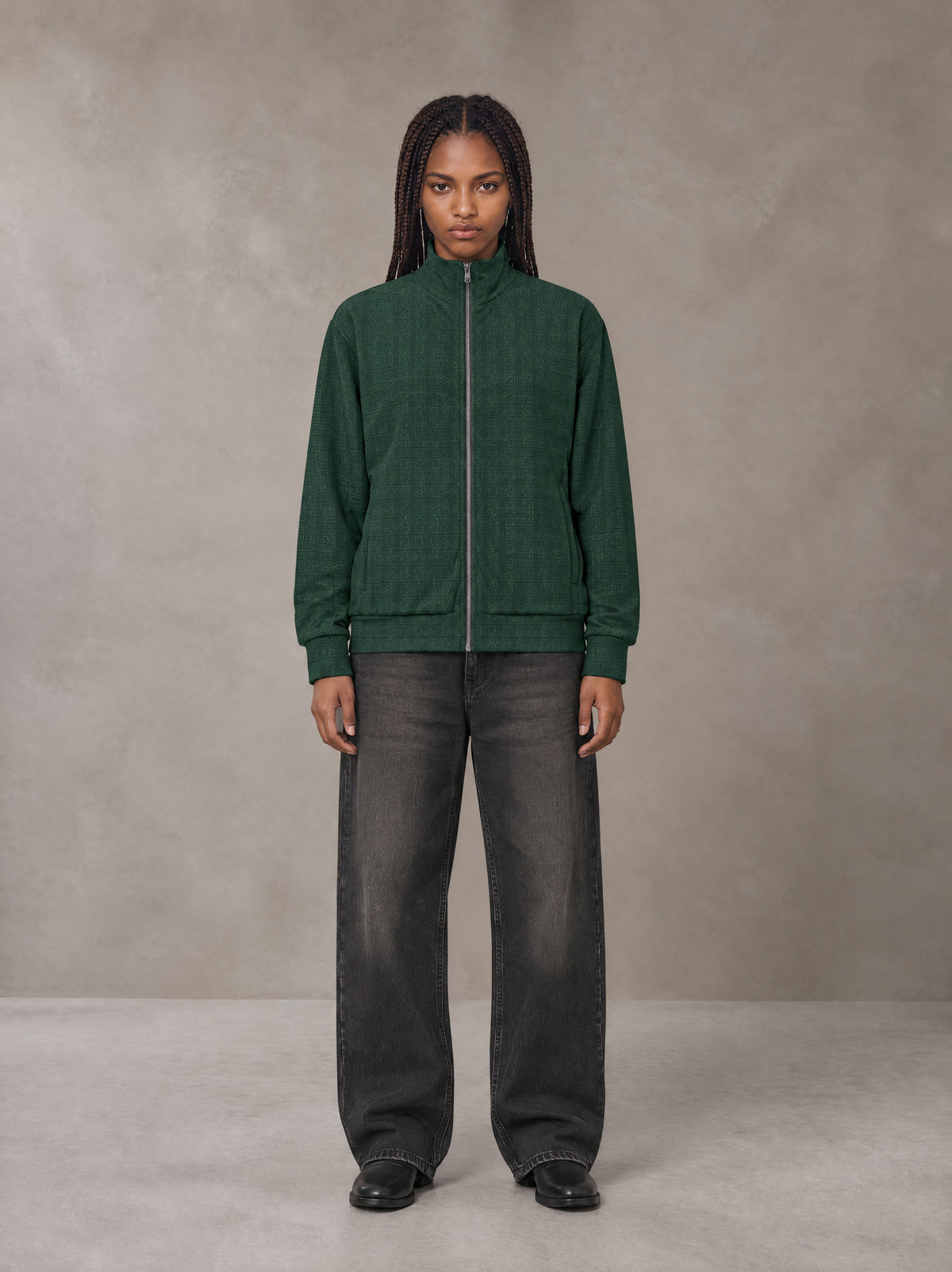 Model wearing the SM Jacquard Track Jacket in Alpine Green, front view.