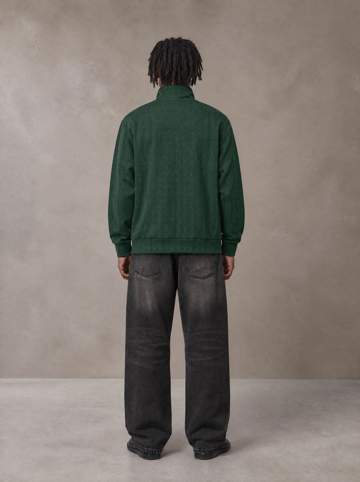 Model wearing the SM Jacquard Track Jacket in Alpine Green, rear view.