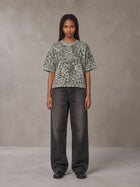 Model wearing the SM Leopard Print Boxy T-shirt in Cement, front view.