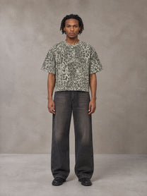 Model wearing the SM Leopard Print Boxy T-shirt in Cement, front view.