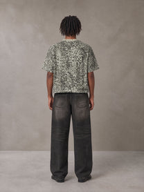Model wearing the SM Leopard Print Boxy T-shirt in Cement, rear view.