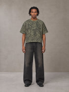 Model wearing the SM Leopard Print Boxy T-shirt in Granite Green, front view.