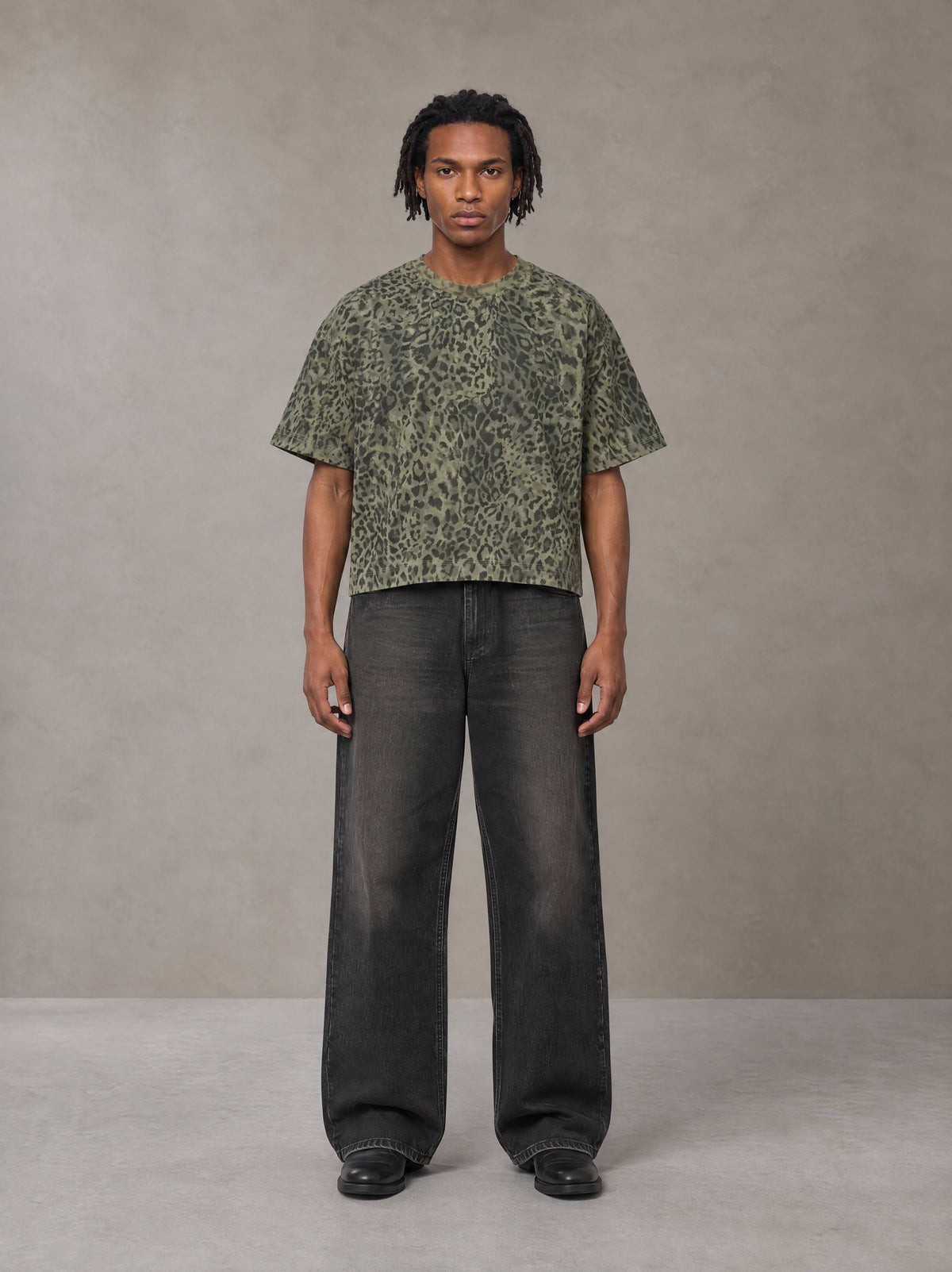 Model wearing the SM Leopard Print Boxy T-shirt in Granite Green, front view.