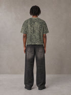 Model wearing the SM Leopard Print Boxy T-shirt in Granite Green, rear view.