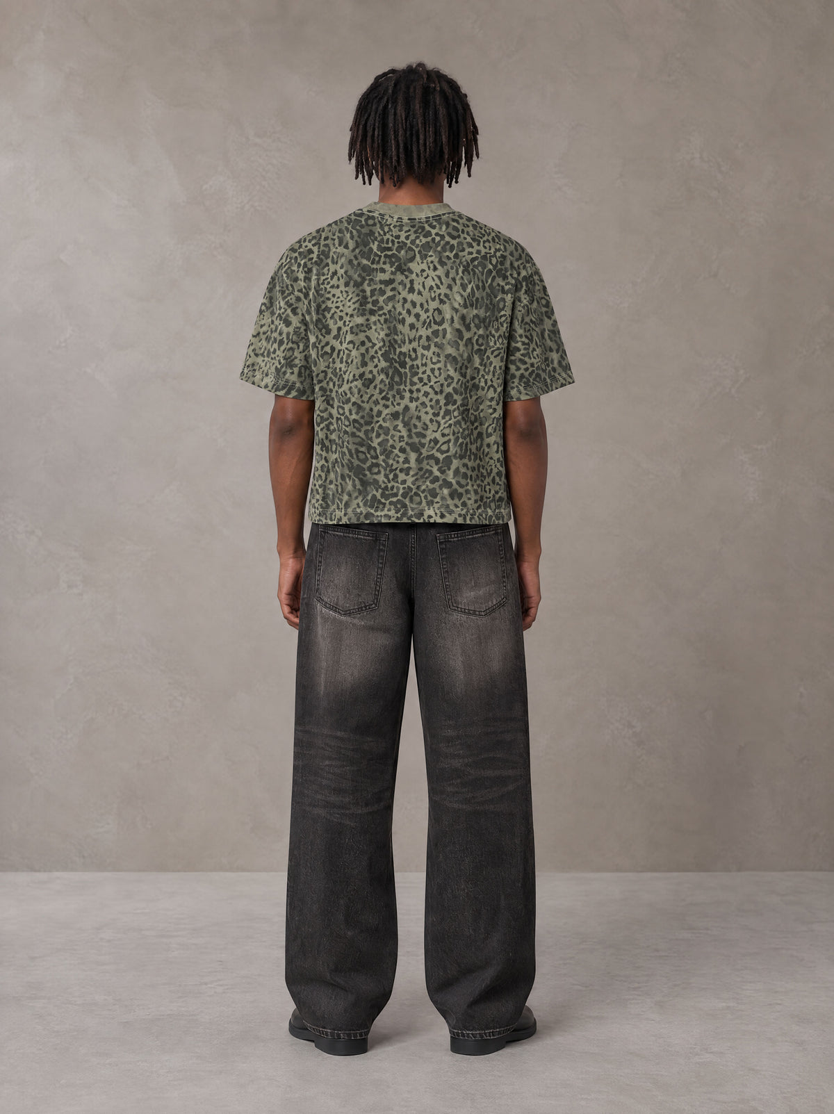 Model wearing the SM Leopard Print Boxy T-shirt in Granite Green, rear view.