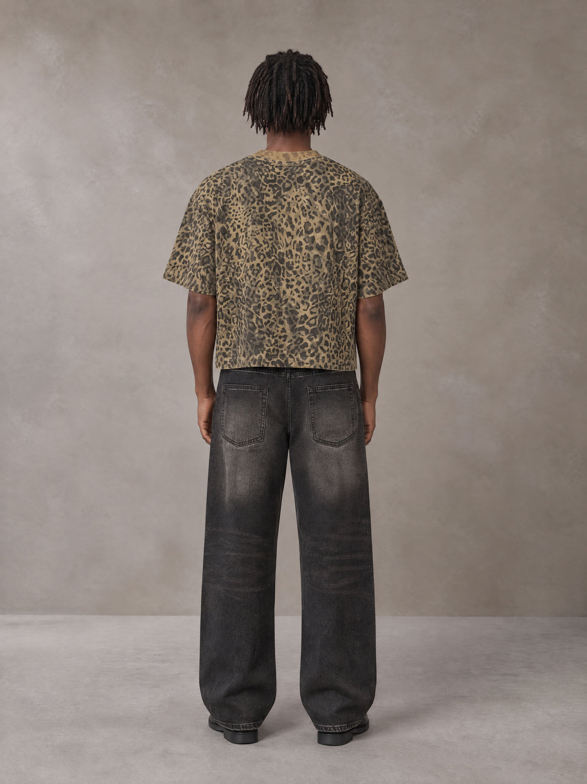 Model wearing the SM Leopard Print Boxy T-shirt in Muesli, rear view.